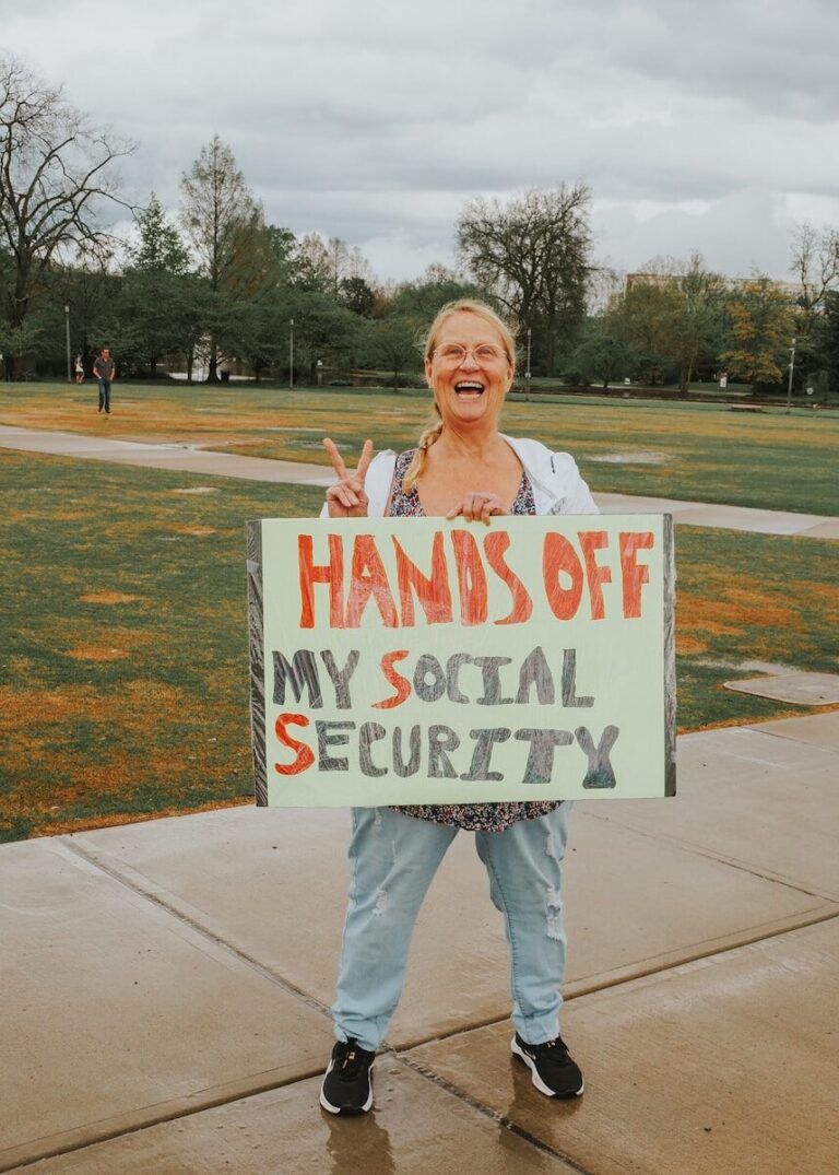 Woman protests with sign: "hands off my social security".